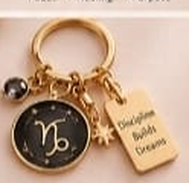 Capricorn keychain with a black enamel disc